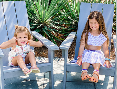 Ruby and Stella smile at the camera.