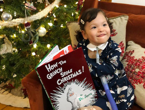 Xio reading her Christmas book.