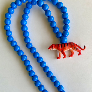Pink Chicken Tiger on Medium Blue Beads 